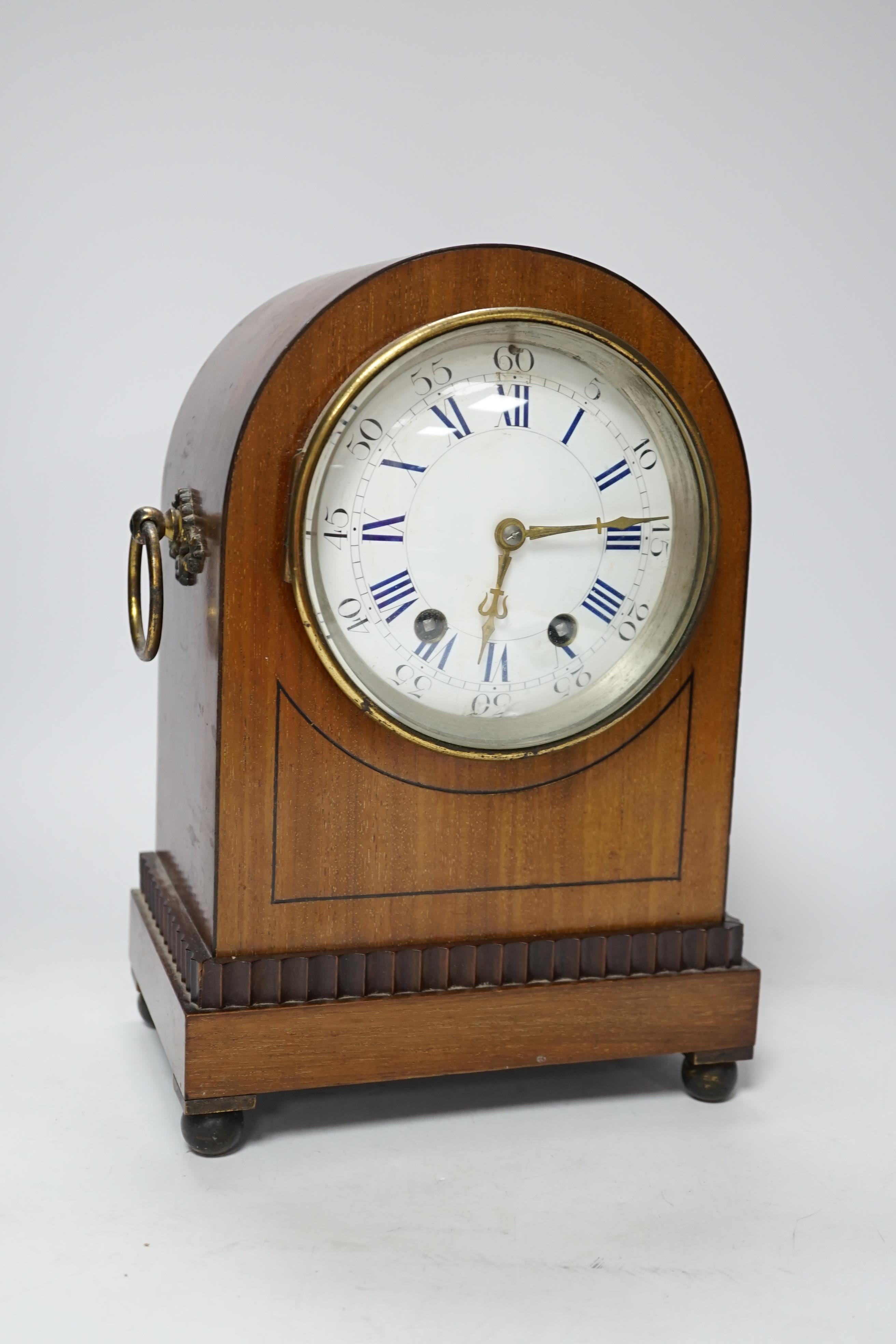 A late 19th century mahogany mantel clock with enamelled Roman numeral dial, 30cm high